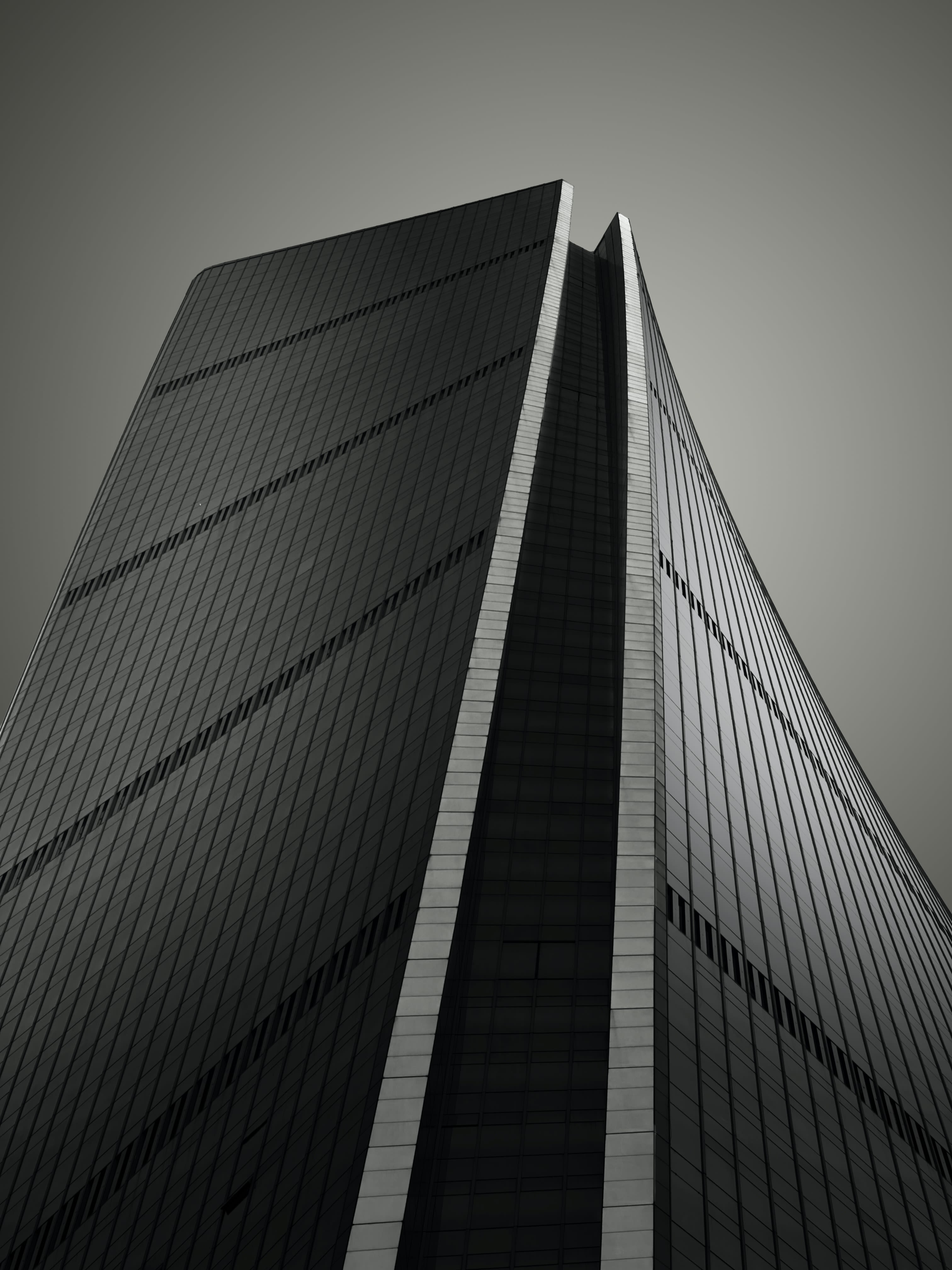a black and white photo of a tall building
